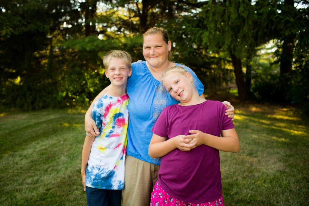 A mother and her son and daughter.