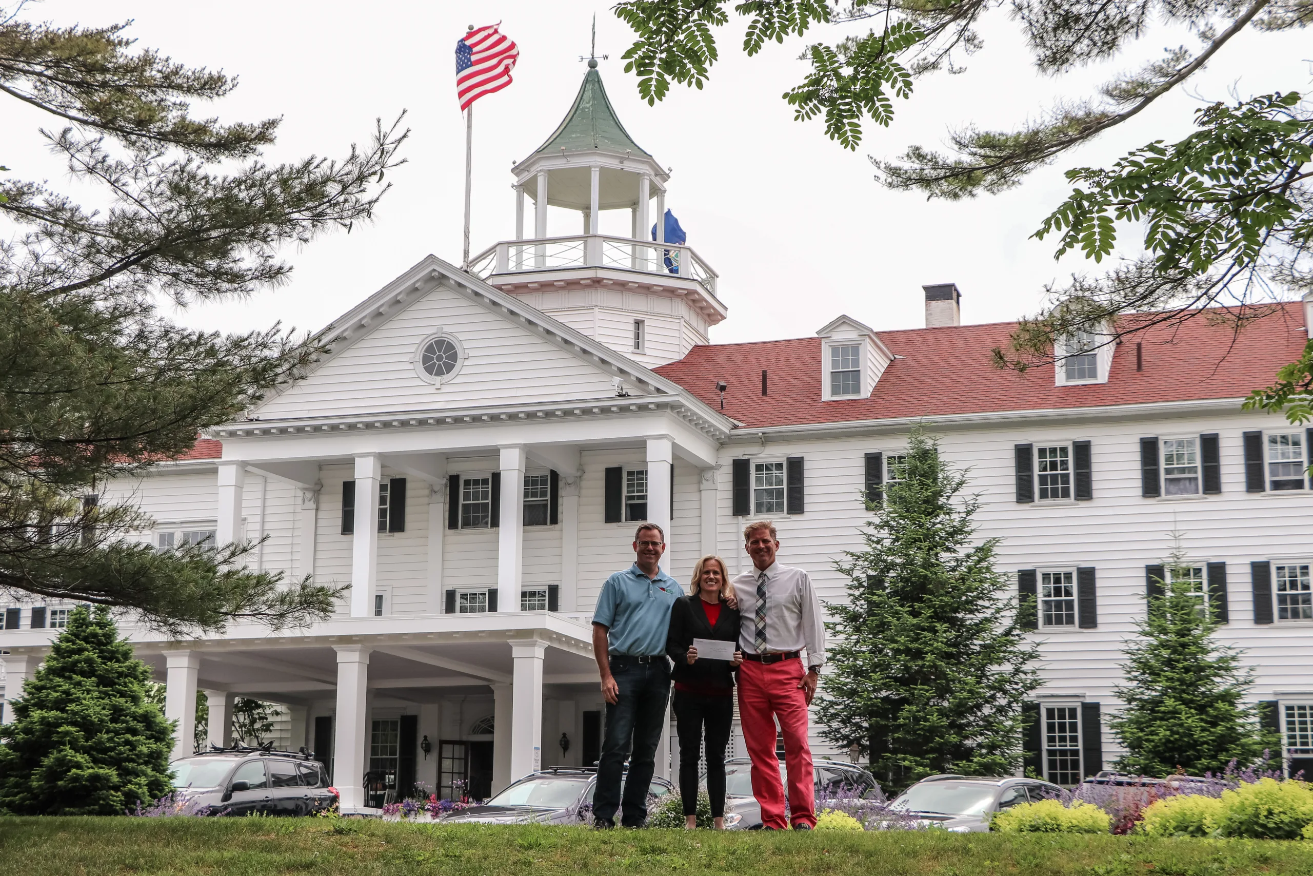 Jim Darroch, Kristen Miale, and John Martin outside The Colony Hotel in Kennebunkport.