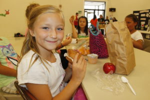 A child participating in the SFSP Summer Food Program in Bangor.