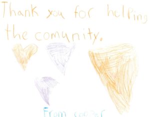 A sign drawn in crayon by 7-year-old Cooper, thanking Adopt-a-Block of Aroostook for supporting the community.