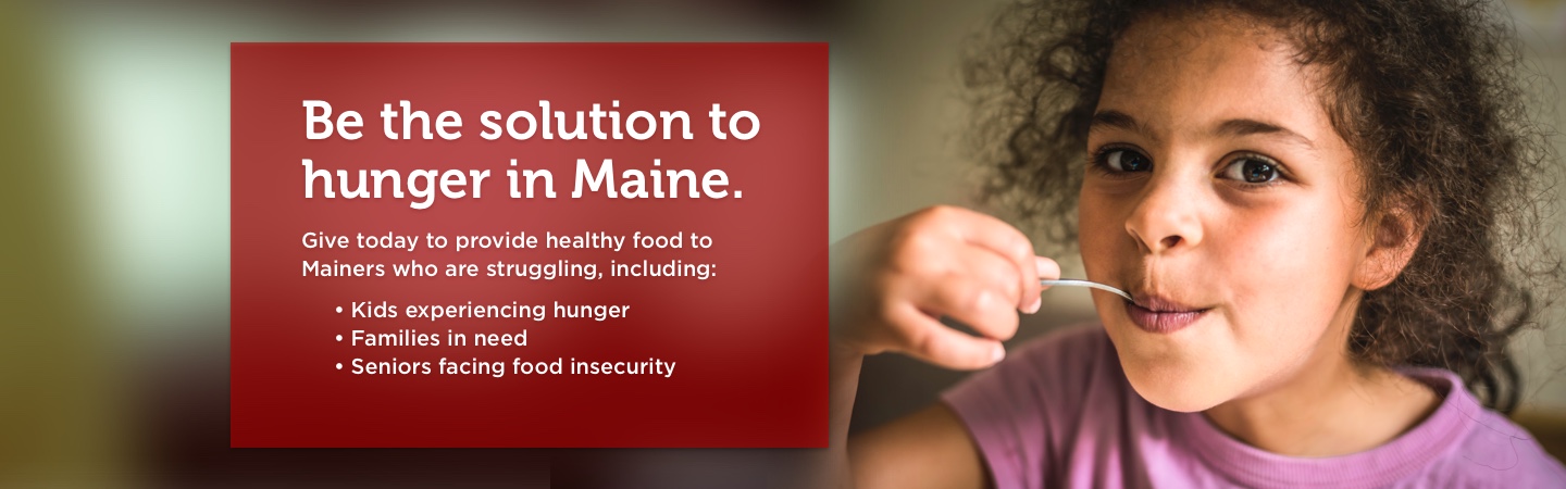 Give today to provide healthy food to Mainers who are struggling, like this young girl with a spoon in her mouth.