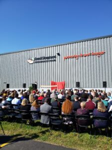 A crowd seated outside to celebrate the grand opening of the Good Shepherd Food Bank distribution center in Hampden, ME, on September 26, 2019.