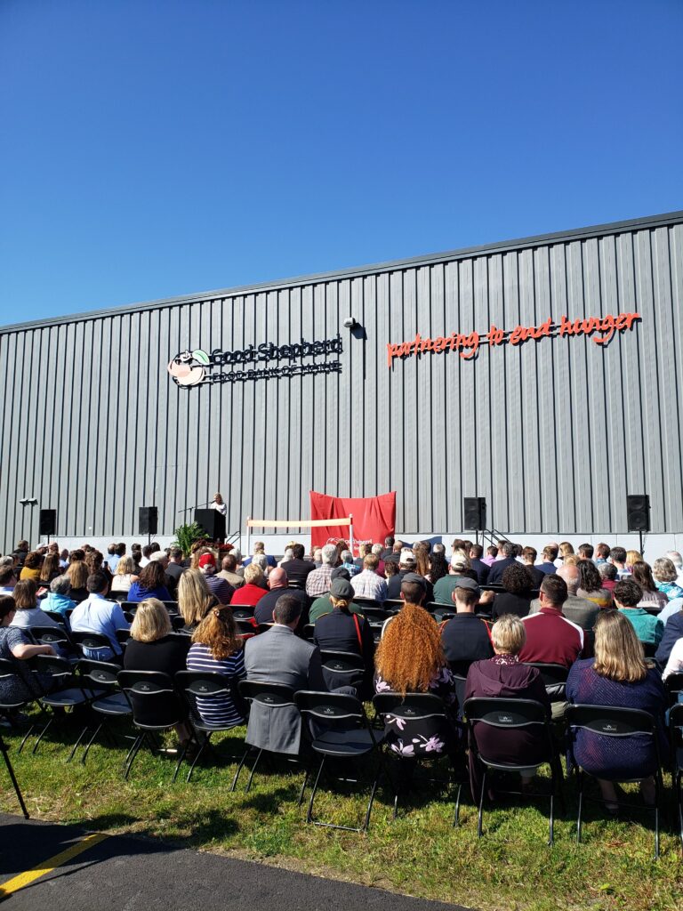 A crowd seated outside to celebrate the grand opening of the Good Shepherd Food Bank distribution center in Hampden, ME, on September 26, 2019.