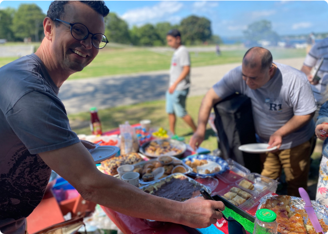 Good Shepherd Food Bank members eating outdoors.