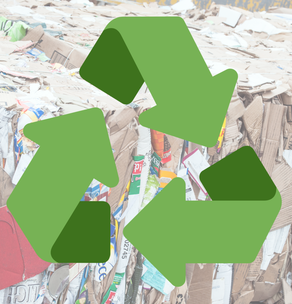 Cardboard Recycling with recycle logo on the top of image of bailed cardboard