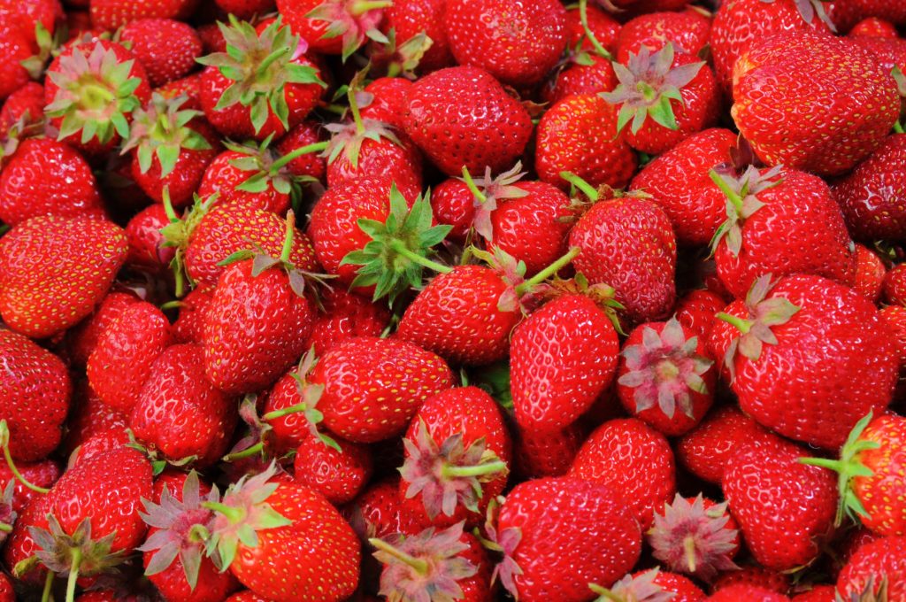 Close-up of a pile of strawberries.